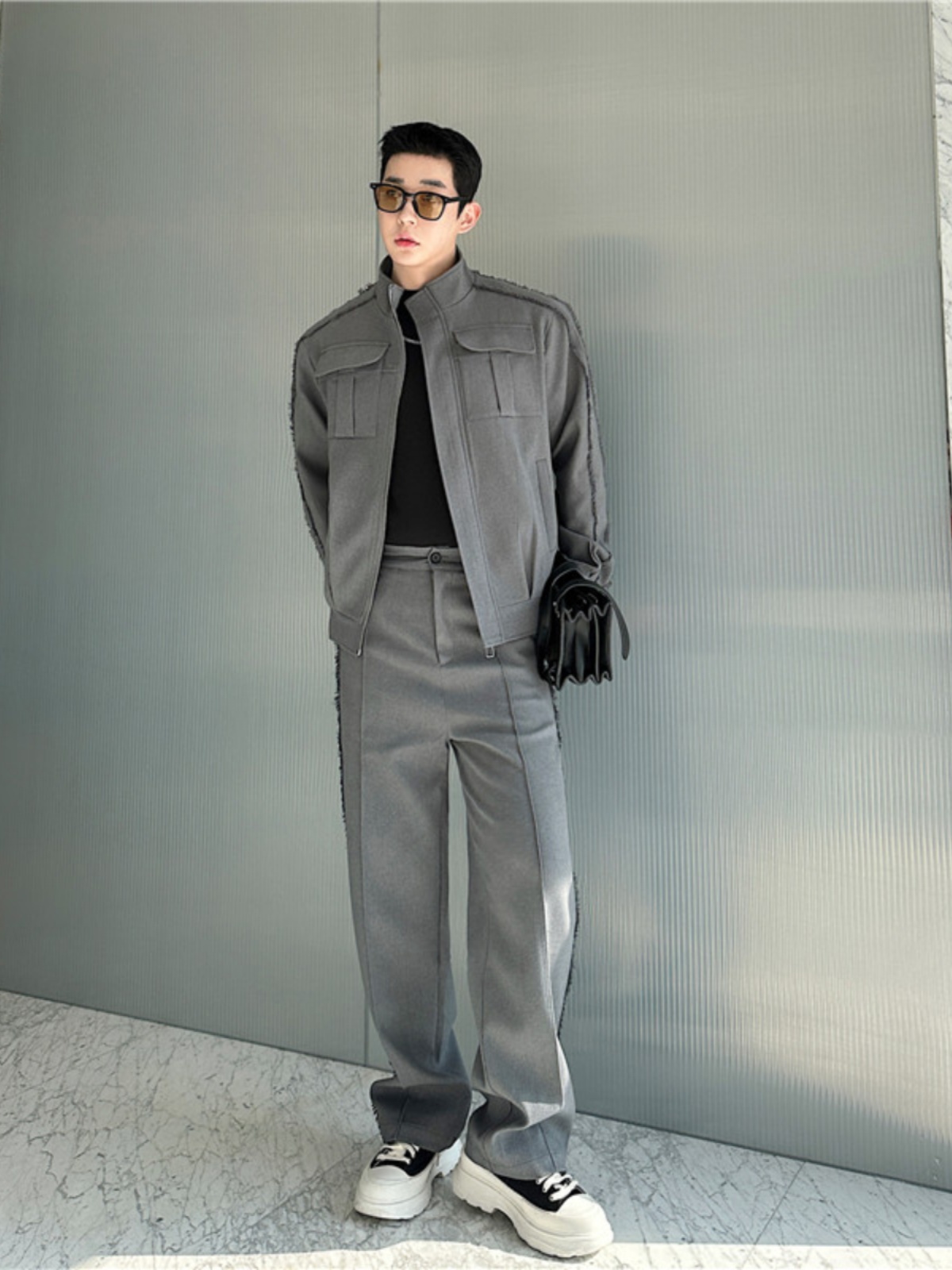 Korean man in a coordinated grey outfit