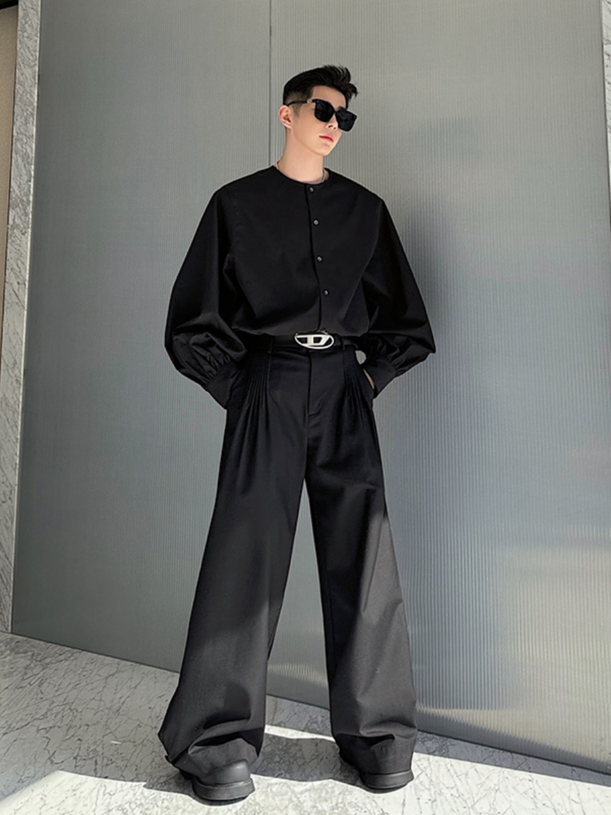 Man wearing high-collared black long-sleeved shirt