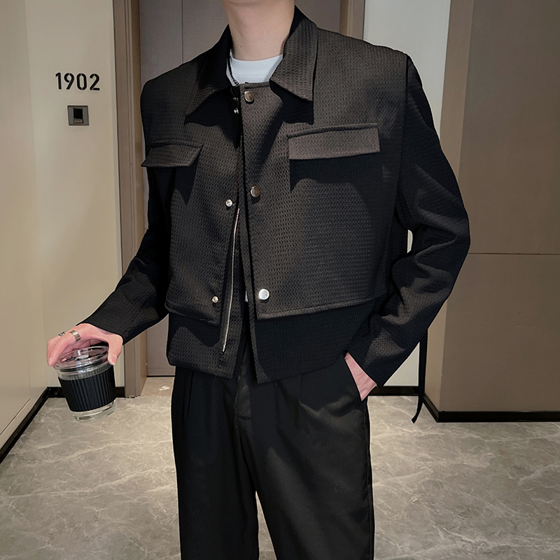Man in an all-black smart casual outfit