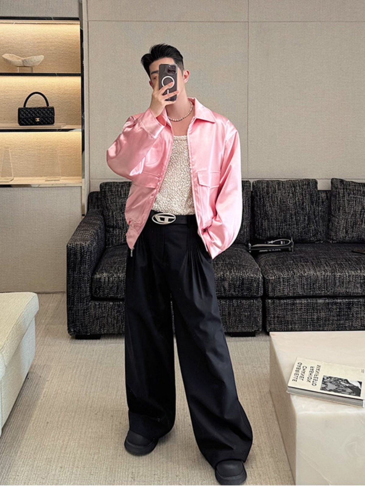 Man in a shiny pink jacket with patterned top